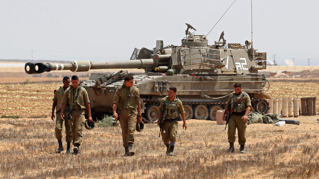 IDF forces on the Gaza Border (Photo: AFP) כוחות צה"ל בגבול רצועת עזה