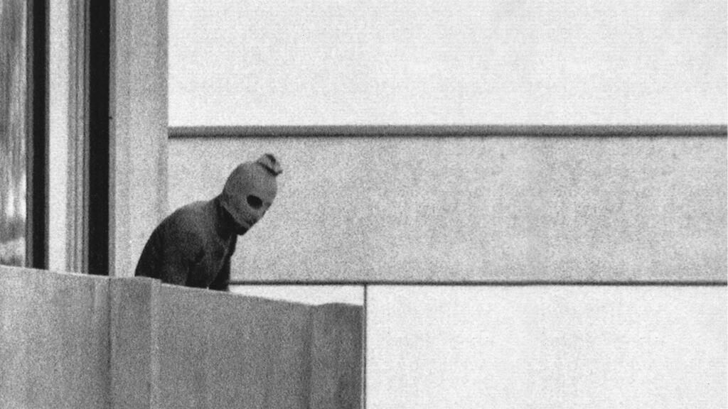 Palestinian attacker overlooking from a balcony during massacre of Israeli athletes in Munich 