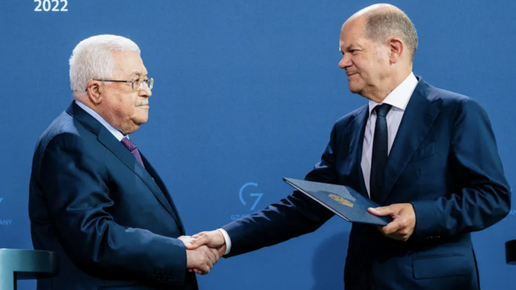 German Chancellor Olaf Scholz and Palestinian Authority President Mahmoud Abbas shake hands during a press conference, in Berlin, Germany