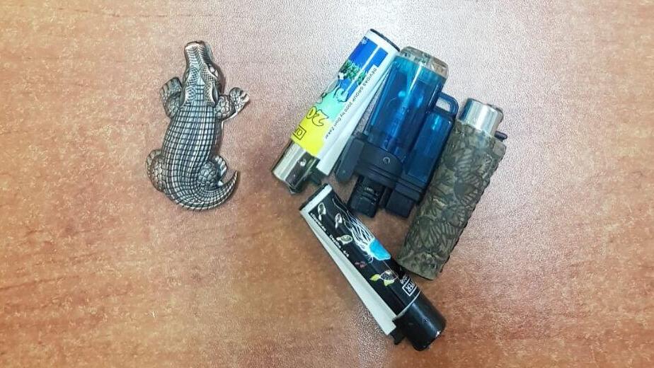 Lighters found on the teen's person (Photo: Israel Police) הכפפות והמצית