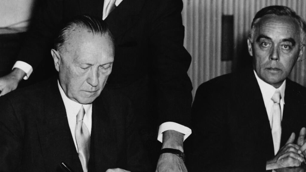 West German Chancellor Konrad Adenauer signs agreements providing compensation for Jews who suffered under Nazi Germany, in Luxembourg in September 1952 (Photo: AP) West German Chancellor Konrad Adenauer signs agreements providing compensation for Jews who suffered under Nazi Germany in a ceremony in Luxembourg on September 1952