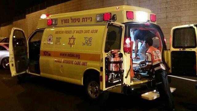Ambulance removes wounded man from suspected West Bank shooting attack 