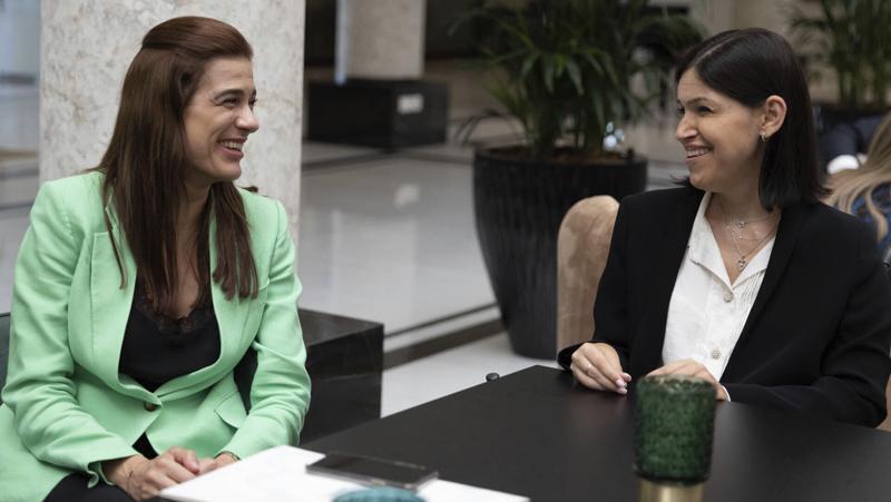 Cyprus Energy Minister Natasa Pilides, left, and Israel's Energy Minister Karine Elharrar, smiling during a meeting in Nicosia, Cyprus, Monday, Sept. 19, 2022 