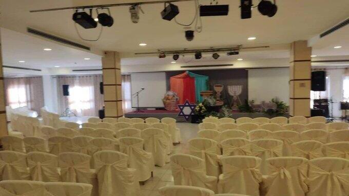Photos from the hotel's conference hall showing cardboard cutouts of a Star of David and Menora (Photo: Twitter) Photos from the hotel's conference hall showing cardboard cutouts of a Star of David and Menora