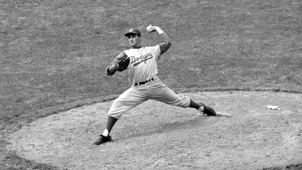 Brooklyn Dodgers southpaw Sandy Koufax pitches against the Chicago Cubs in the eighth inning of a baseball game, May 16, 1957, in Chicago, Illinois, United States 