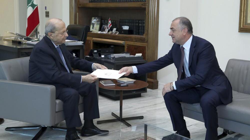 Lebanese President Michel Aoun, left, receives the final draft of the maritime border agreement between Lebanon and Israel from the deputy of Lebanese prime minister Elias Bou Saab and who leads the Lebanese negotiations, in Beirut, Lebanon, Tuesday, Oct. 11, 2022 (Photo: Dalati Nohra via AP) Lebanese President Michel Aoun, left, receives the final draft of the maritime border agreement between Lebanon and Israel from the deputy of Lebanese prime minister Elias Bou Saab and who leads the Lebanese negotiations, in Beirut, Lebanon, Tuesday, Oct. 11, 2022