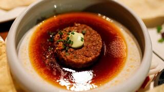 A dish containing a 3D printed plant-based meat product mimicking beef 