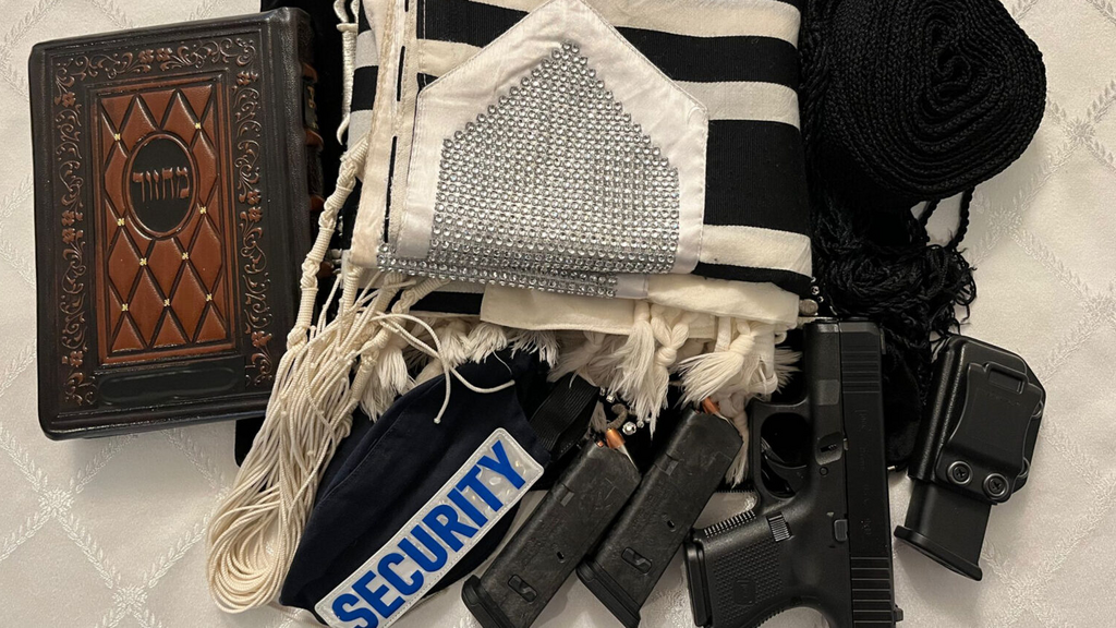 A New York Jewish gun owner took this photo of his weapons and and his Jewish paraphernalia 