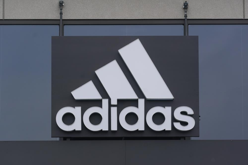 A sign is displayed in front of an Adidas retail store in Paramus, N.J., Tuesday, Oct. 25, 2022 