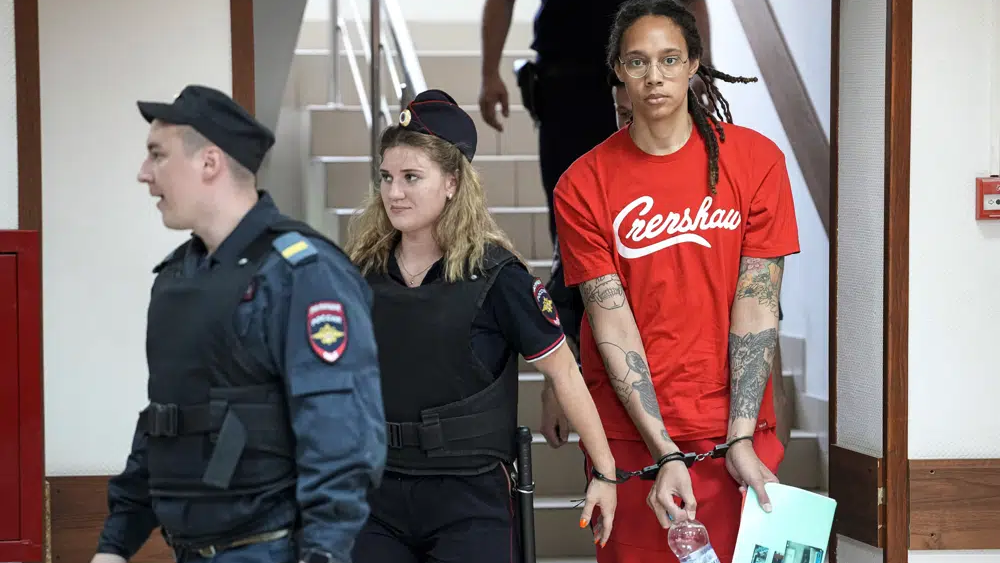 WNBA star and two-time Olympic gold medalist Brittney Griner is escorted to a courtroom for a hearing in Khimki just outside Moscow, on July 7, 2022 
