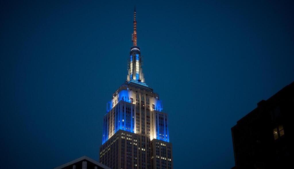 The Empire State Building is illuminated with blue and white lights in celebration of Hanukkah, an annual New York City tradition 