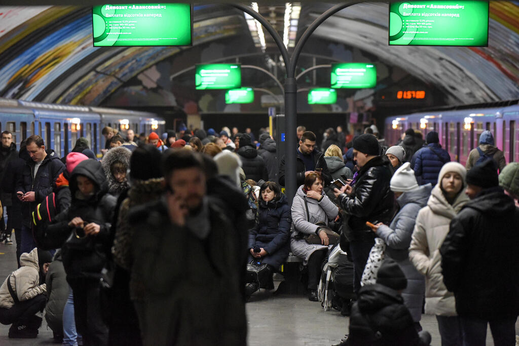 Ukrainians shelter in underground train stations as Russia launches massive strike on cities 
