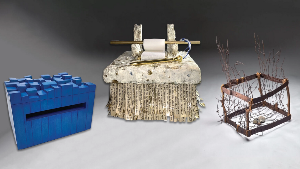 The artist-created tzedek boxes on display at the Heller Museum include, from left, Tobi Kahn's "Zahryz III," Holly Berger Markhoff's "Justice Knows No Other," and Tina Marcus' "The Collection Box." 