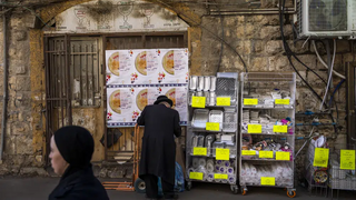 An ultra-Orthodox Jewish man buys disposable plastic dishes in Jerusalem's Mea Shearim neighborhood, Friday, Jan. 20, 2023. Israel's new government is in the process of repealing a new tax on single-use plastics. Ultra-Orthodox Jews, who have large families and use large quantities of disposable cups, plates and cutlery, say the tax unfairly targeted them 