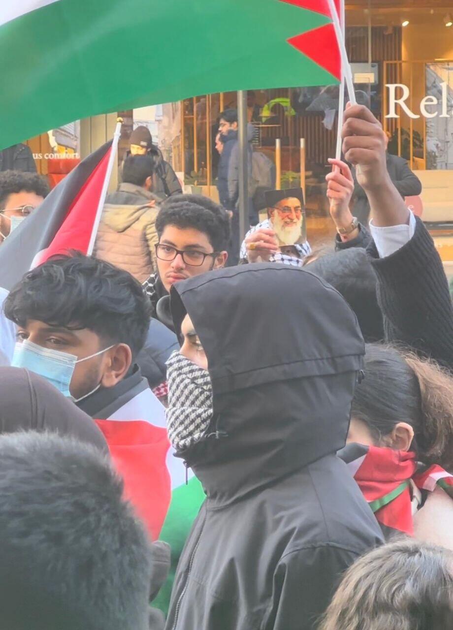 Anti-Israel protesters fly Palestinian flags and hold up photo of Iranian Supreme Leader Ayatollah Ali Khamenei during a rally at University College London, February 7, 2023 