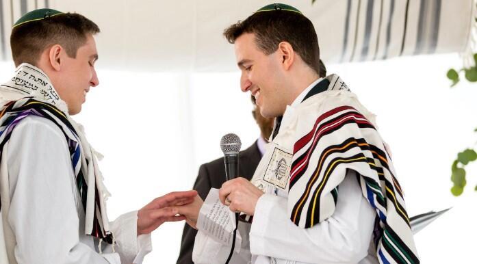Nadiv Schorer, right, married Ariel Meiri in 2020 with Orthodox rabbi Avram Mlotek officiating 