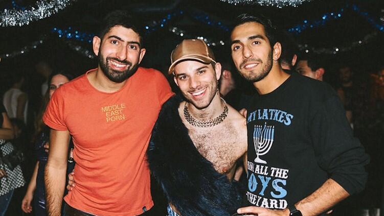 Stuart Meyers, center, is the founder of “Flaminggg” a queer, Jewish nightlife that embraces and celebrates both identities 
