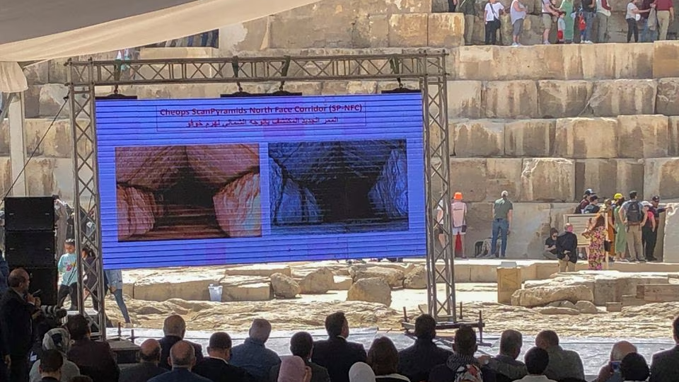 An image of a hidden corridor inside the Great Pyramid of Giza that was discovered by researches from the the Scan Pyramids project is displayed during a news conference of the Egyptian Minister of Tourism and Antiquities Ahmed Eissa in front of the Great Pyramid of Giza, Giza, Egypt, March 2, 2023 