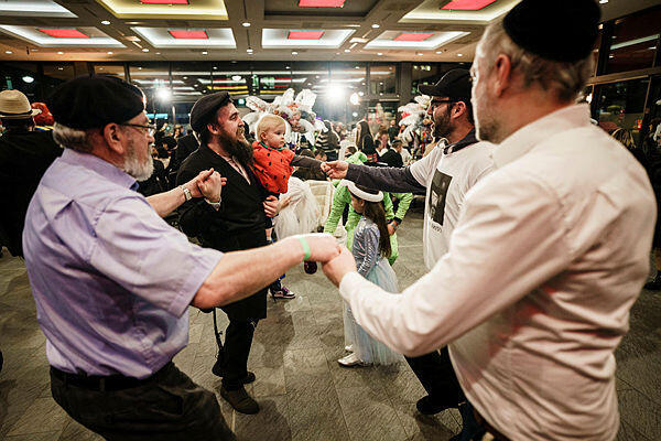 Participants of a festive event related to Chabad Berlin Jewish community dance during Purim Holiday in Berlin, Germany, 07 March 2023