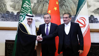 Chain's top diplomat Wang Yi, Ali Shamkhani, the secretary of Iran’s Supreme National Security Council, and Minister of State and national security adviser of Saudi Arabia Musaad bin Mohammed Al Aiban pose for pictures during a meeting in Beijing, China, March 10, 2023 