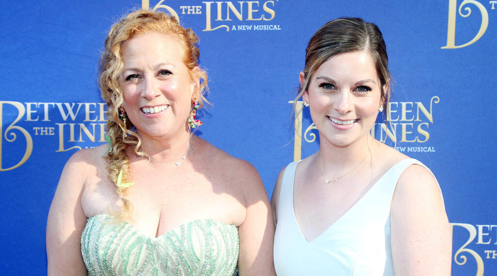 Jodi Picoult and her daughter Samantha Van Leer pose at the opening night of the musical "Between The Lines," July 11, 2022 in New York City