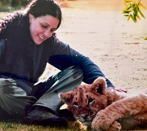 Dr. Benjamin-Fink with a lion cub