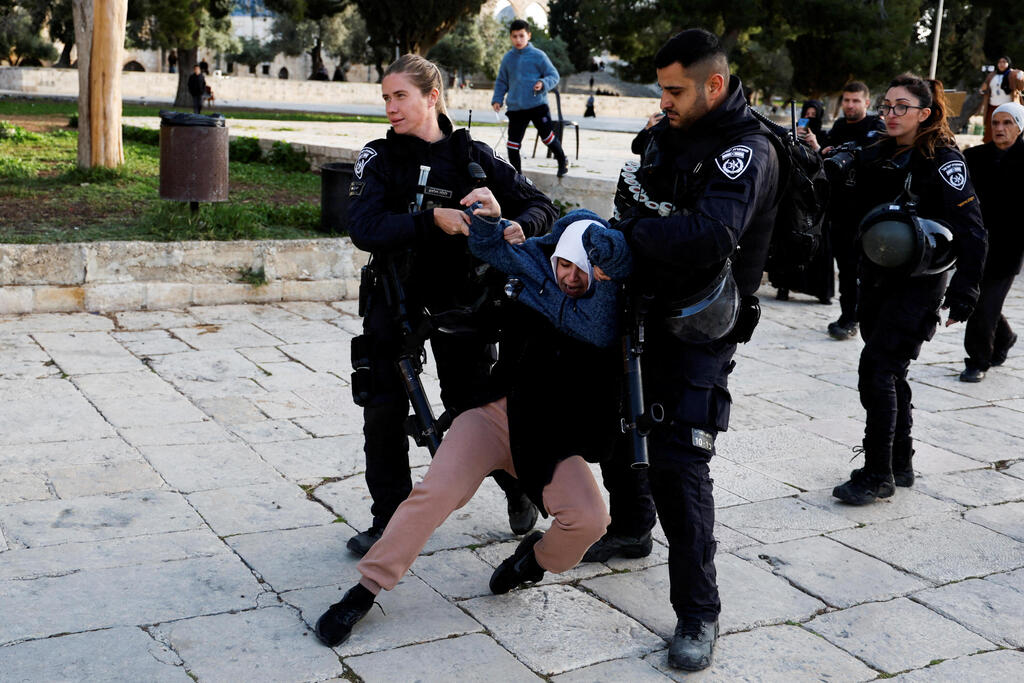 A Palestinian woman detained by police during clashed in Jerusalem last week 