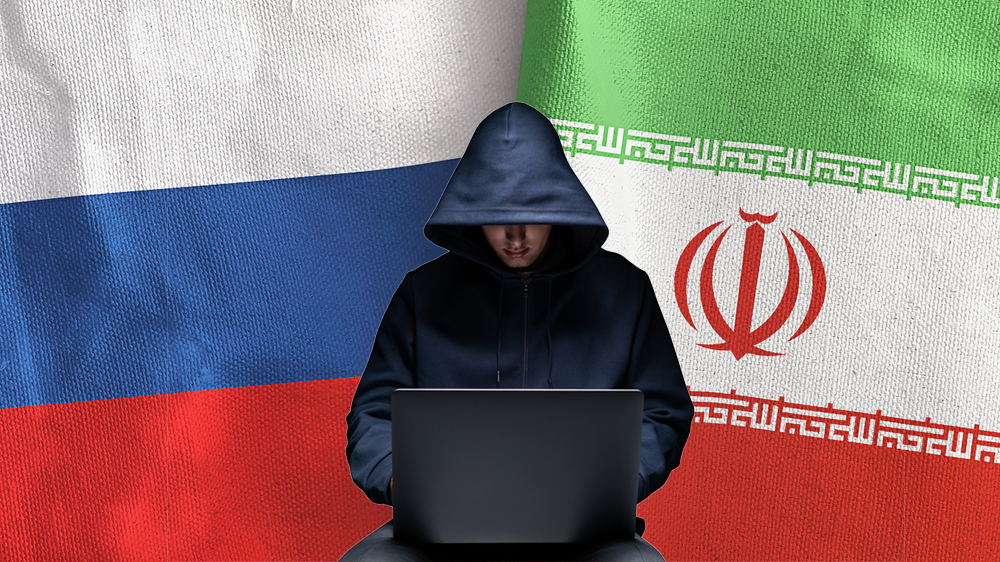 האקר על רקע דגלי רוסיה ואיראן