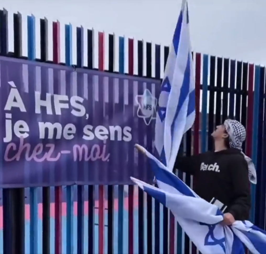 Man tearing down Israeli flags outside Jewish day school, Montreal, Canada 