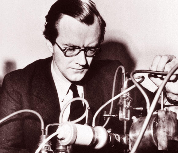 Decoding the structure of the alpha helix, which is found in many proteins. Maurice Wilkins with an X-ray machine in his laboratory