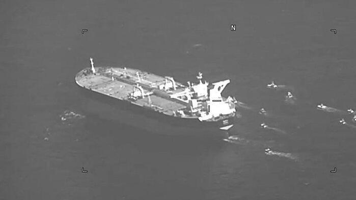 Fast-attack IRGC crafts swarming Panama-flagged oil tanker Niovi as it transits the Strait of Hormuz 