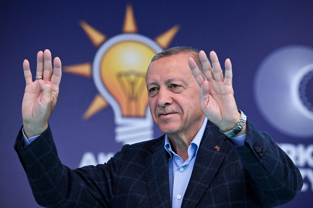 Turkish President Tayyip Erdogan addresses his supporters during a rally 