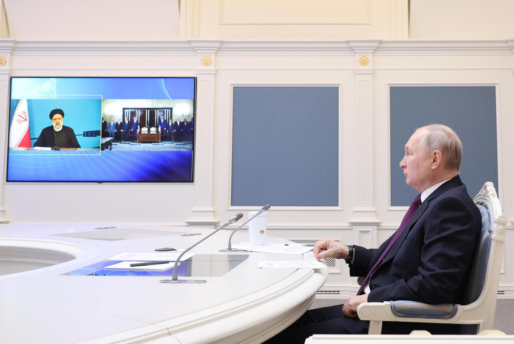 Russian President Vladimir Putin on a video conference with Iranian President Ebrahim Raisi signing an agreement for the international North–South Transport Corridor (Photo: EPA) Russian President Vladimir Putin on video conference With Iranian President Ebrahim Raisi signing an agreement for the international North–South Transport Corridor
