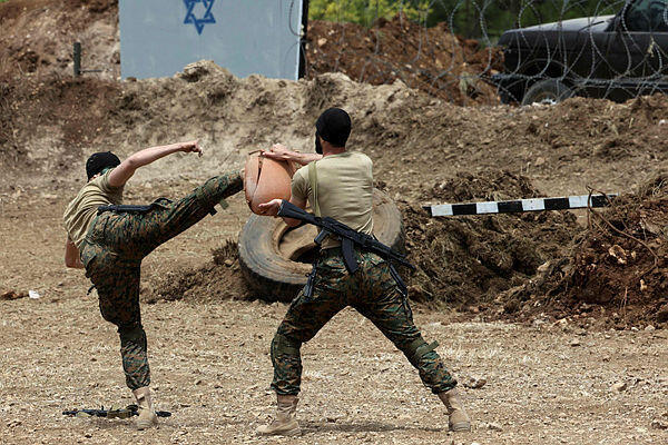 Lebanese Hezbollah fighters demonstrate military manuevers during a press tour in the southern Lebanese village of Aaramta, on May 21, 2023, ahead of the anniversary of the Israeli withdrawal from Lebanon (Photo: Anwar Amro) Lebanese Hezbollah fighters demonstrate military manuevers during a press tour in the southern Lebanese village of Aaramta, on May 21, 2023, ahead of the anniversary of the Israeli withdrawal from Lebanon