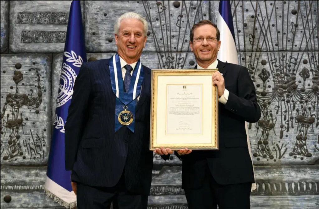Michael Siegal receives the Israeli Presidential Medal of Honor and citation from President Isaac Herzog, at the President’s Residence, Jerusalem, December 11, 2022 
