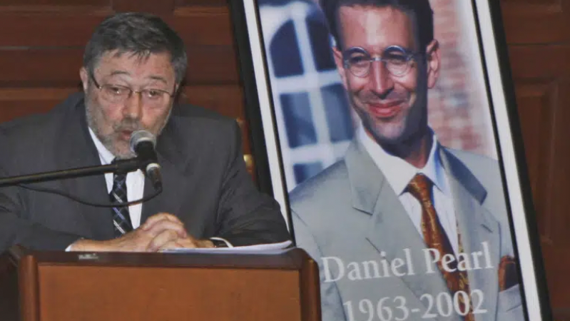 Dr. Judea Pearl, left, father of American journalist Daniel Pearl, right, who was killed by terrorists in 2002, speaks in Miami Beach, Fla., April 15, 2007 