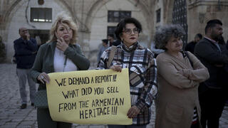 Members of the Armenian community protest a contentious deal that stands to displace residents