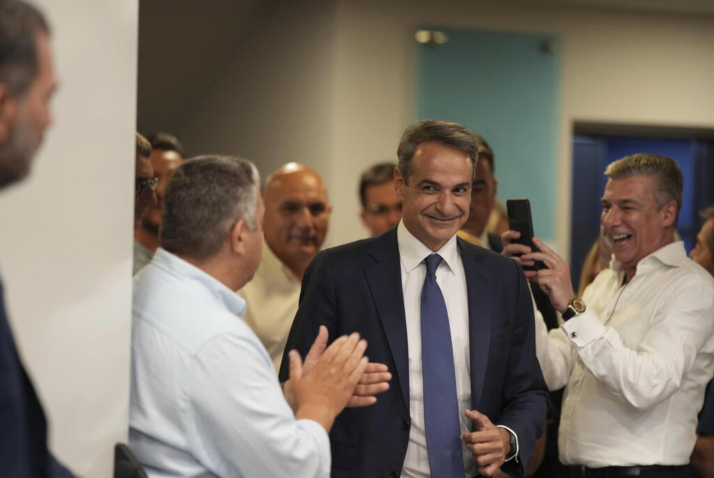 צילום: AP ראש ממשלת יוון קיריאקוס מיצוטקיס ניצחון בחירות