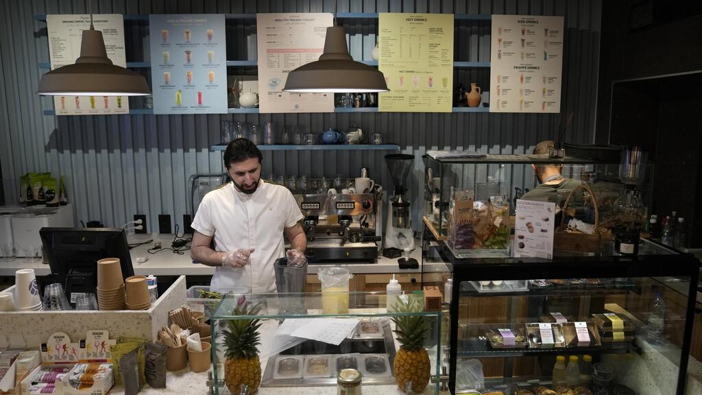 Abbas Bazzi prepares drinks at Le Marché Bio, the organic cafe and grocery store he co-owns 