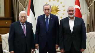 Palestinian Authority President Mahmoud Abbas (L) and Hamas chief Ismail Haniyeh (R) meeting with Turkish President Recep Tayyip Erdogan (C) at the Presidential Complex in Ankara, Turkey.