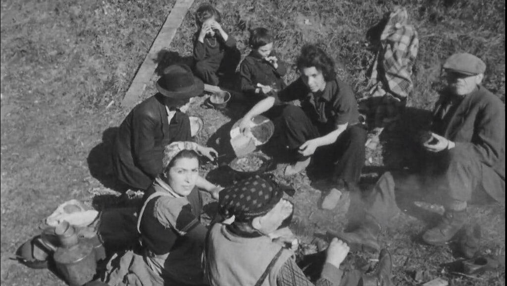 Gita Be'eri (wearing headscarf, looking at camera) and other Jews liberated from the Nazi death train 