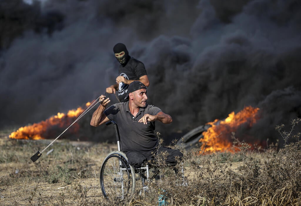 צילום: EPA/MOHAMMED SABER התפרעויות פלסטינים גבול רצועת עזה