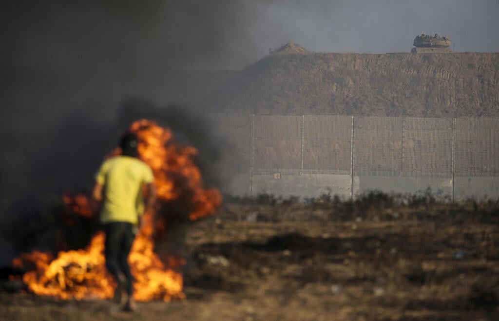 צילום: EPA/MOHAMMED SABER התפרעויות פלסטינים בגבול רצועת עזה
