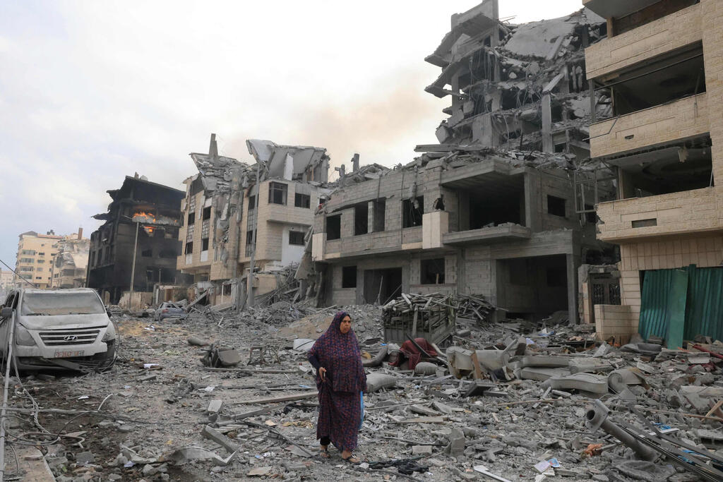 הריסות בשכונת רימאל בעזה (צילום: MOHAMMED ABED / AFP) הריסות בעזה
