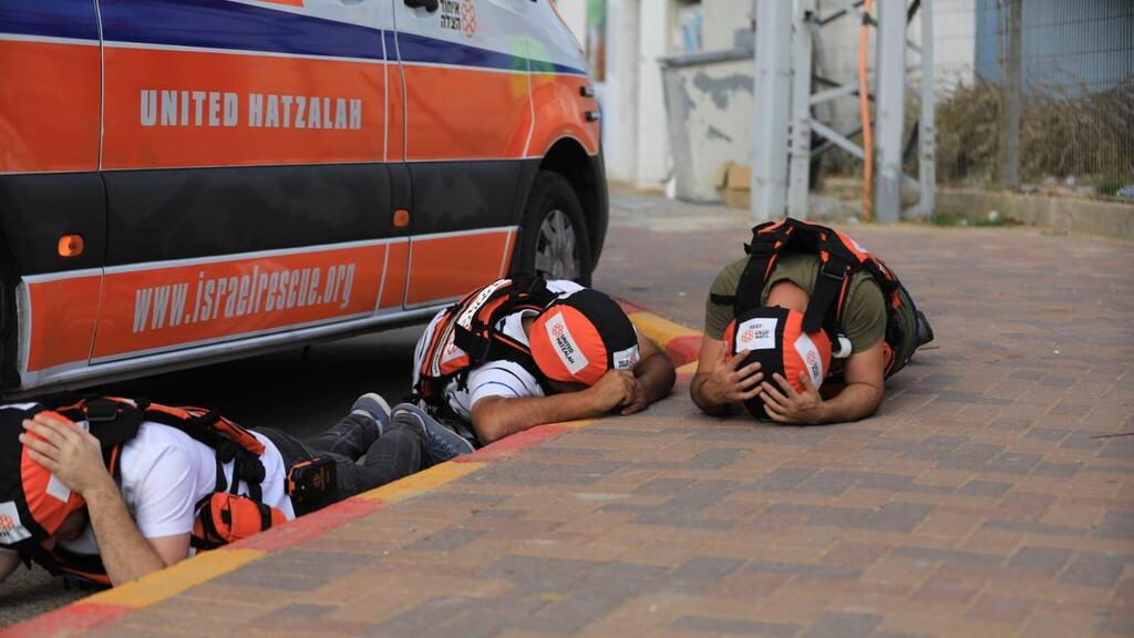 United Hatzalah ambulance volunteers take cover from rocket fire in Sderot (Photo: Oren Levi, United Hatzalah) A volunteer ambulance shift taking cover from rocket fire in Sderot