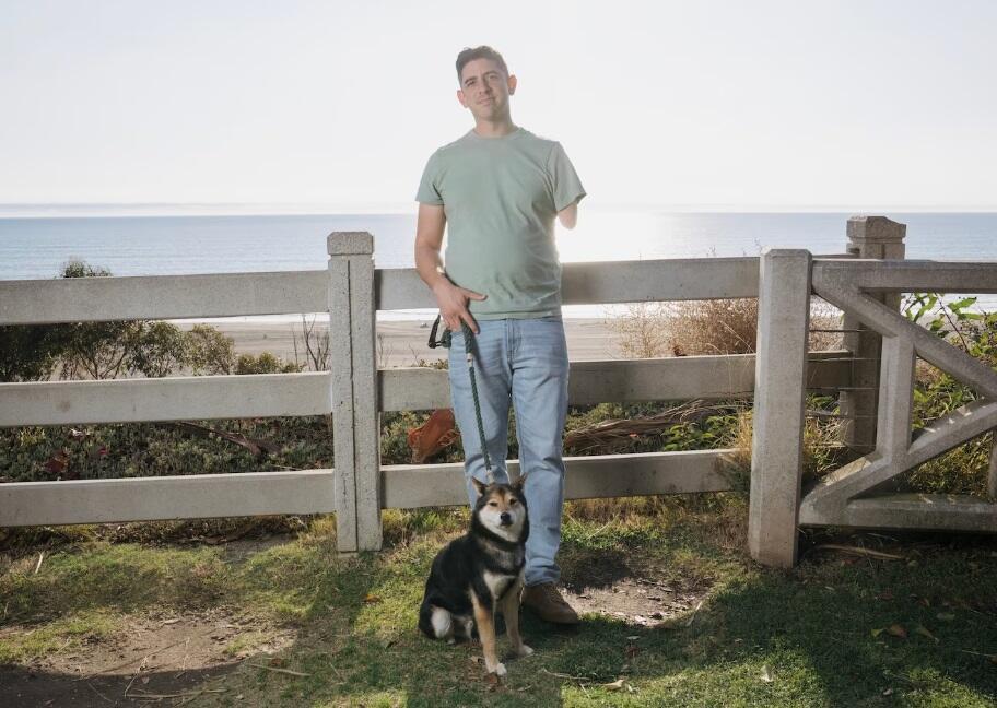 Izzy Ezagui with his dog, Punch 