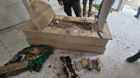 Police find weapons cache buried in grave in Nazareth