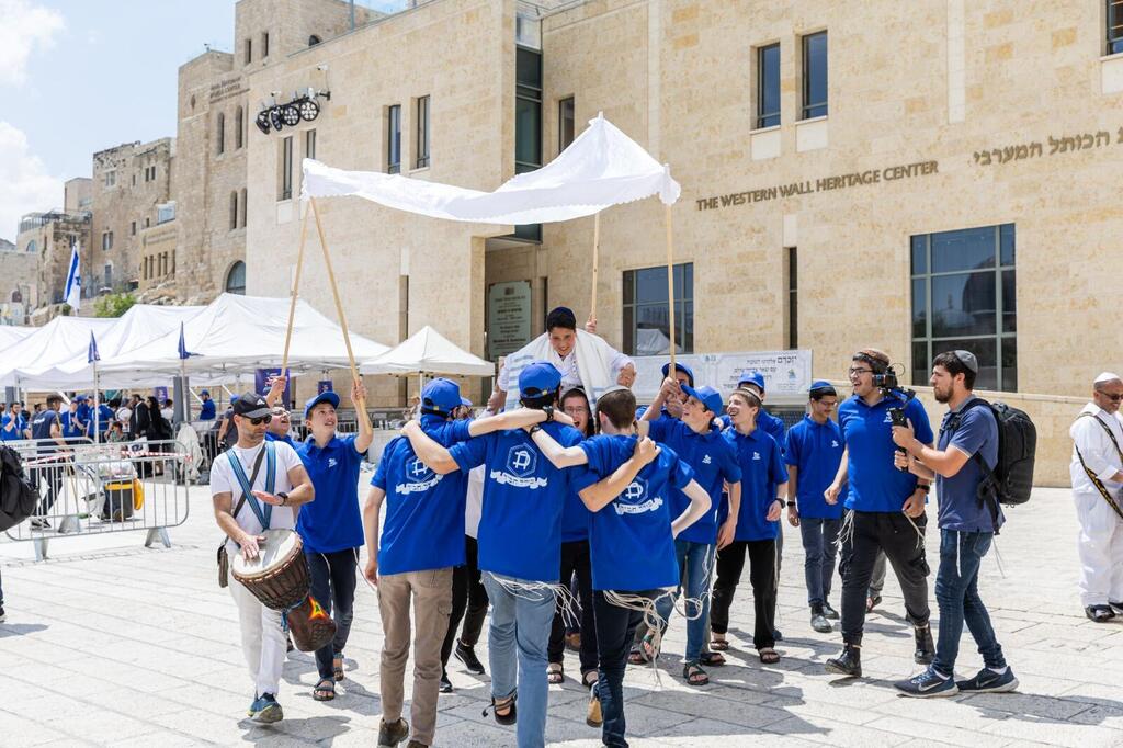 Israeli orphan Refael is danced down to the Western Wall for his bar mitzvah (Photo: Mendy Kornet) Israeli orphan Refael is danced down to the Western Wall for his bar mitzvah