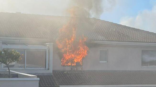 Israeli Olympic sailor, coach rescue elderly woman from fire in Marseille