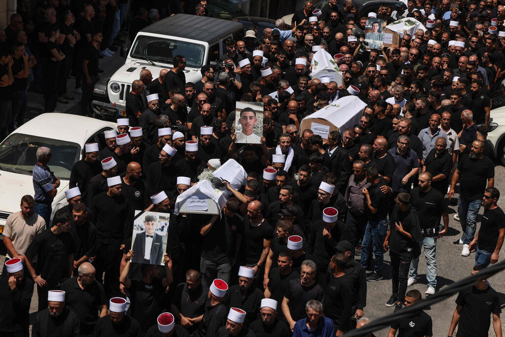 Majdal Shams mass funeral (Photo: Menahem Kahana/ AFP) הלוויית הילדים שנרצחו במתקפת חיזבאללה במגרש הספורט שבמג'דל שמס